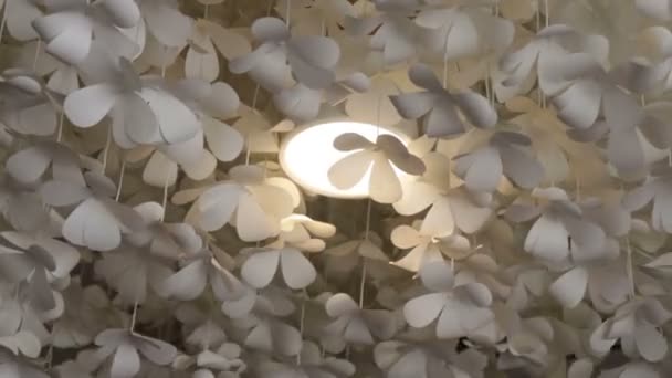 White flower paper hanging from the ceiling Stock Video Footage by  ©nalinrat #162217912